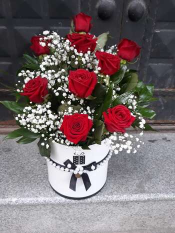White box with red roses